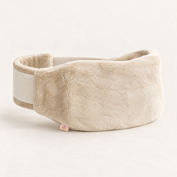 Cream Hot Hugger wearable hot water bottle cover showing the adjustable wraparound strap