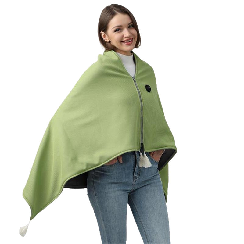 Mint green USB heated shawl with tassels and button fastening on a model