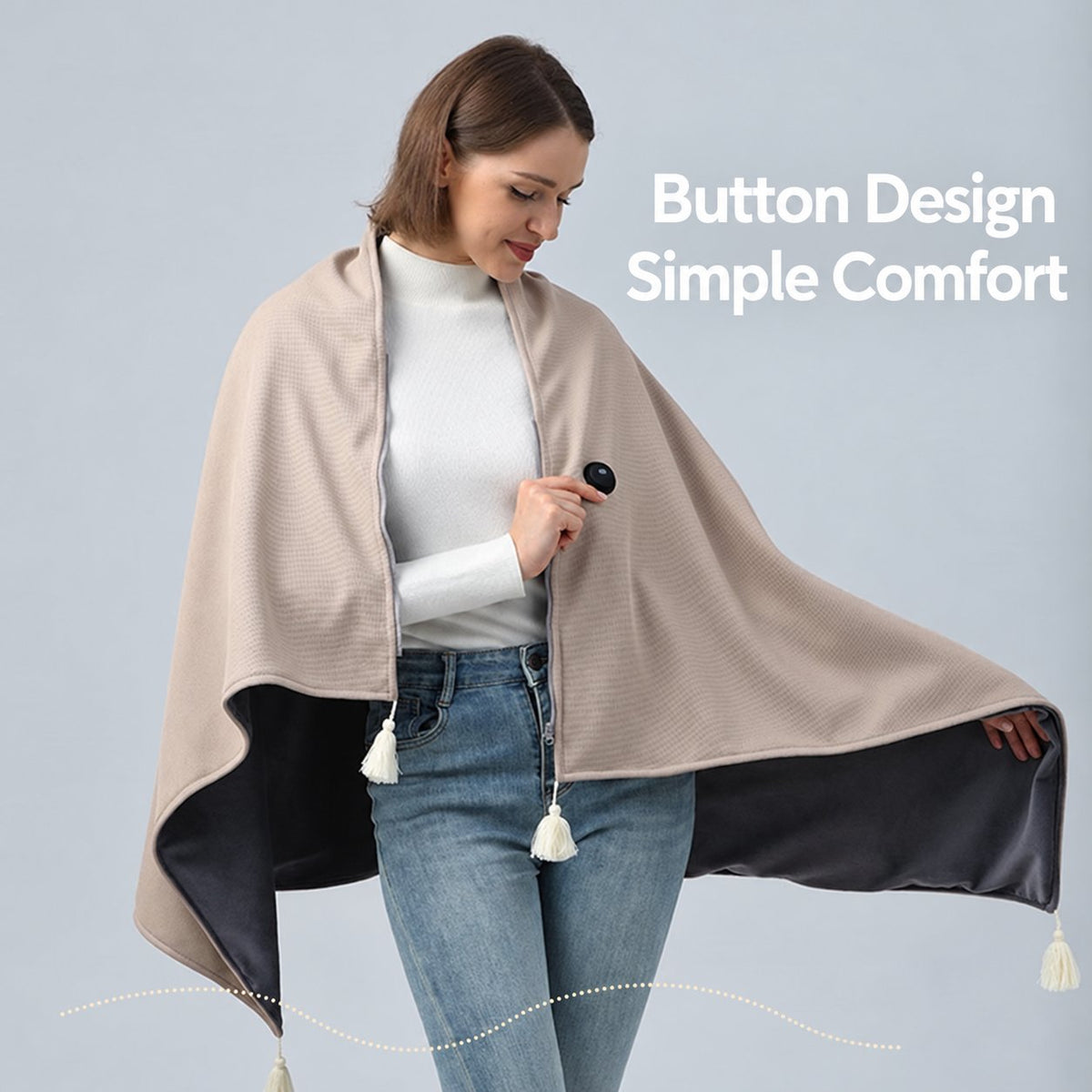 Ivory heated shawl showing button fastening and contrasting reverse