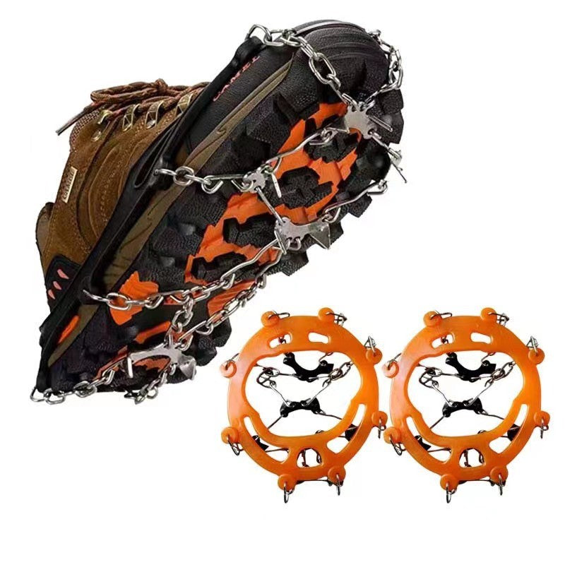 Orange chain ice grips on a demonstration walking boot with the separate harness pair
